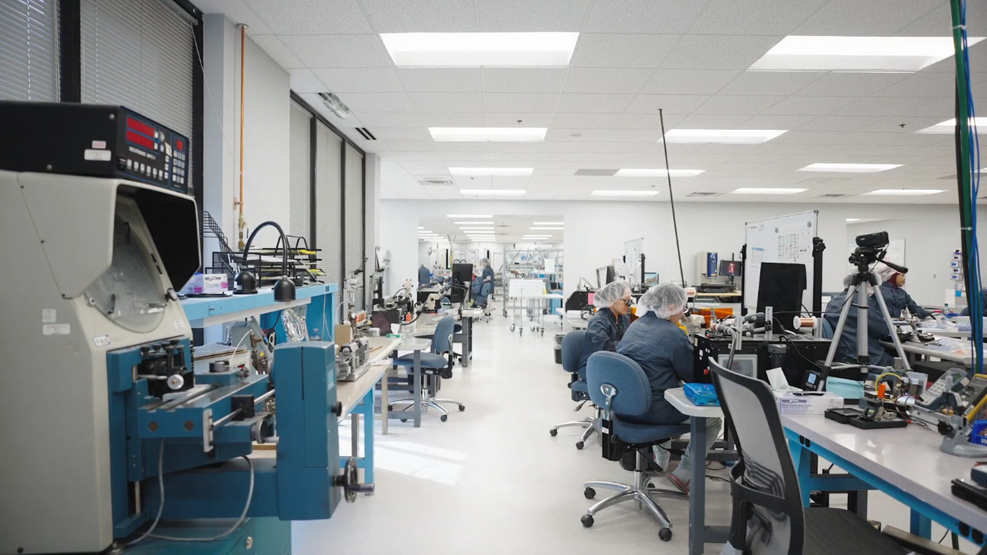 Production and assembly floor with operators at workstations