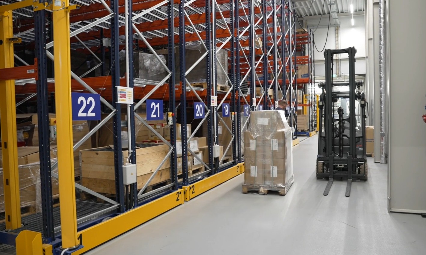 Warehouse with high-bay racking and a forklift